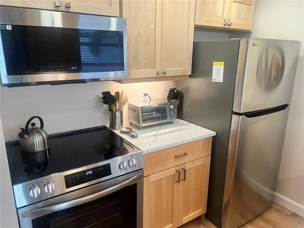 a kitchen with a stove and a microwave