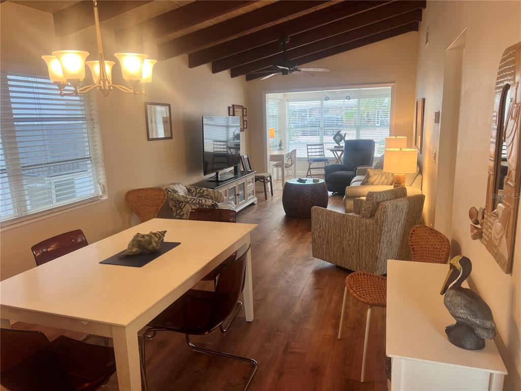 6020 Midnight Pass Road, Unit 38 Sarasota, FL 34242 - Photo 8 of 11 a view of a dining room with furniture window and outside view