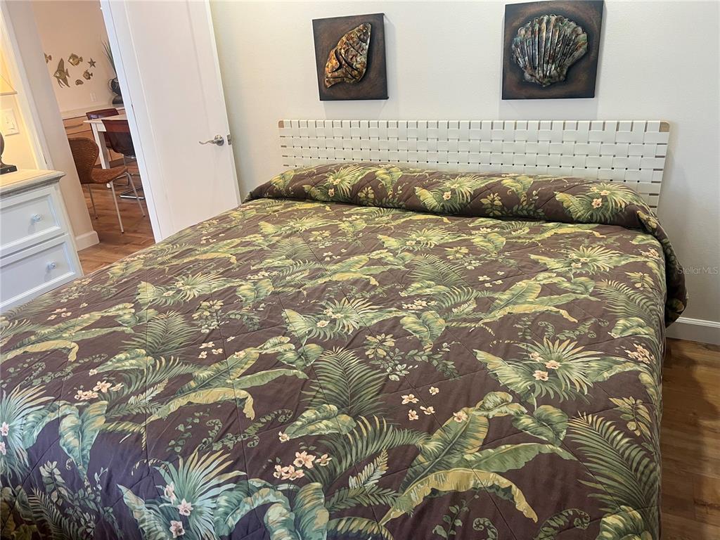 6020 Midnight Pass Road, Unit 38 Sarasota, FL 34242 - Photo 10 of 11 a bedroom with a bed and a couch