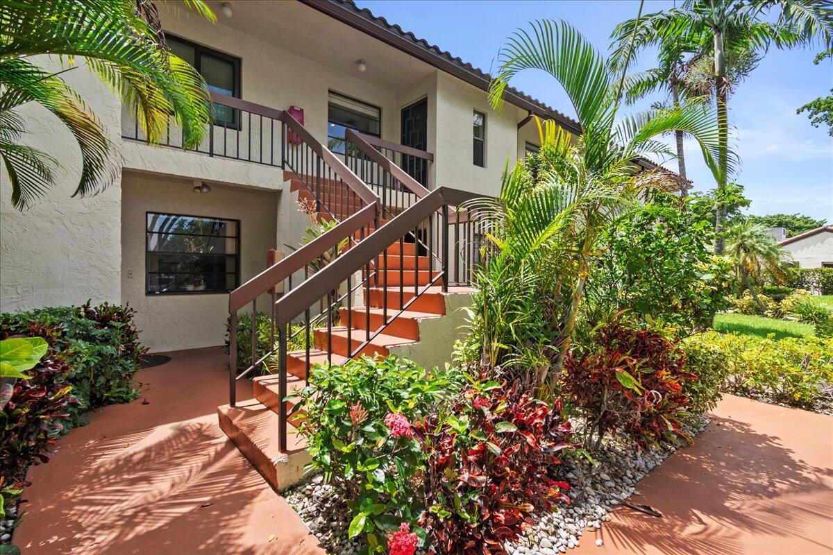 a view of a house with a flower garden