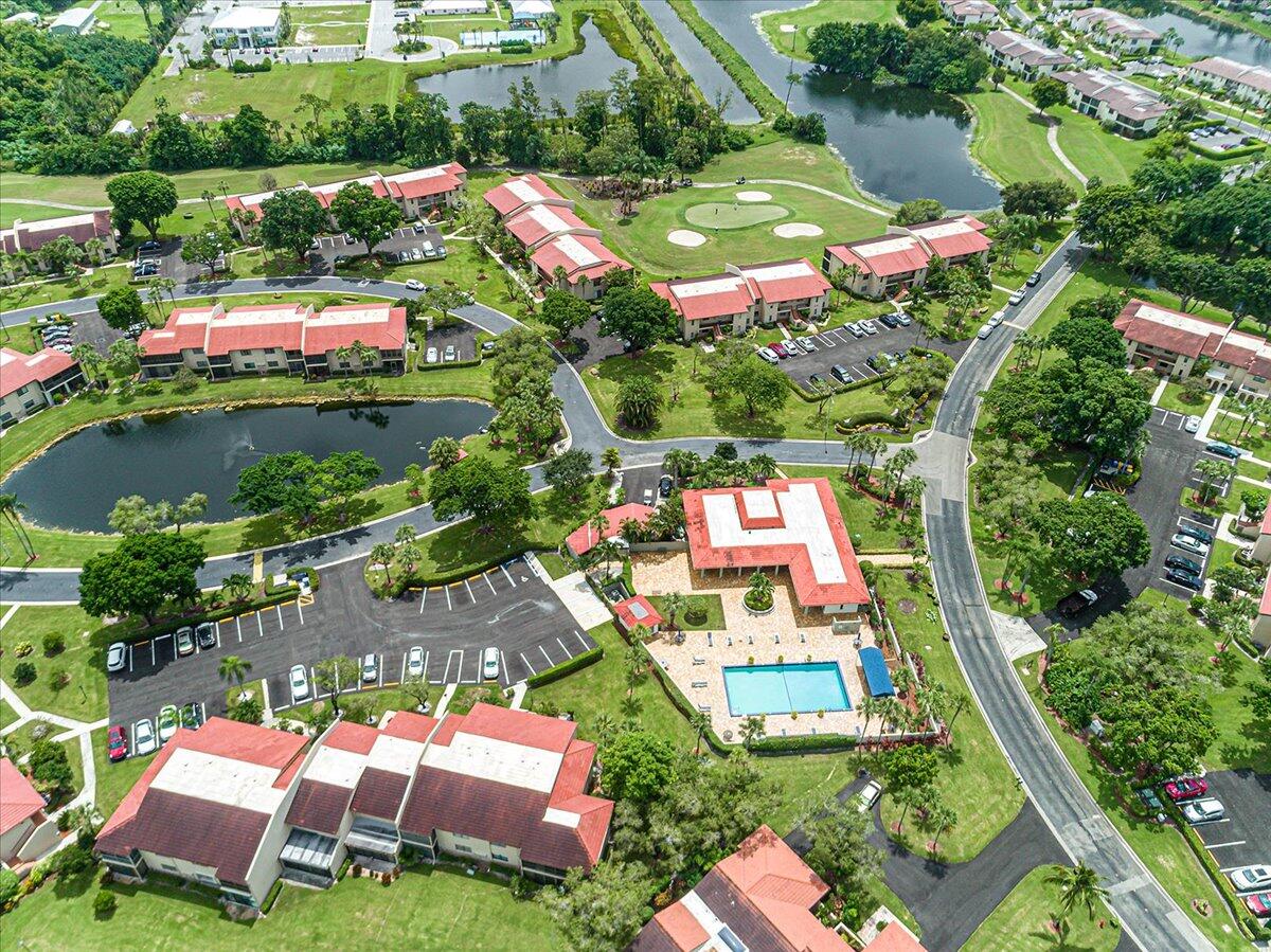 21719 Arriba Real, Unit J Boca Raton, FL 33433 - Photo 23 of 33 an aerial view of a house with a garden and lake view
