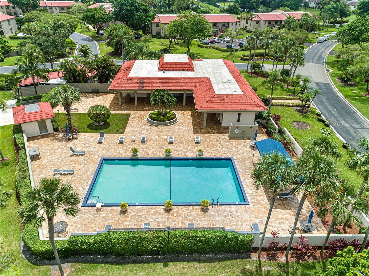 21719 Arriba Real, Unit J Boca Raton, FL 33433 - Photo 27 of 33 an aerial view of a house with yard swimming pool and outdoor seating