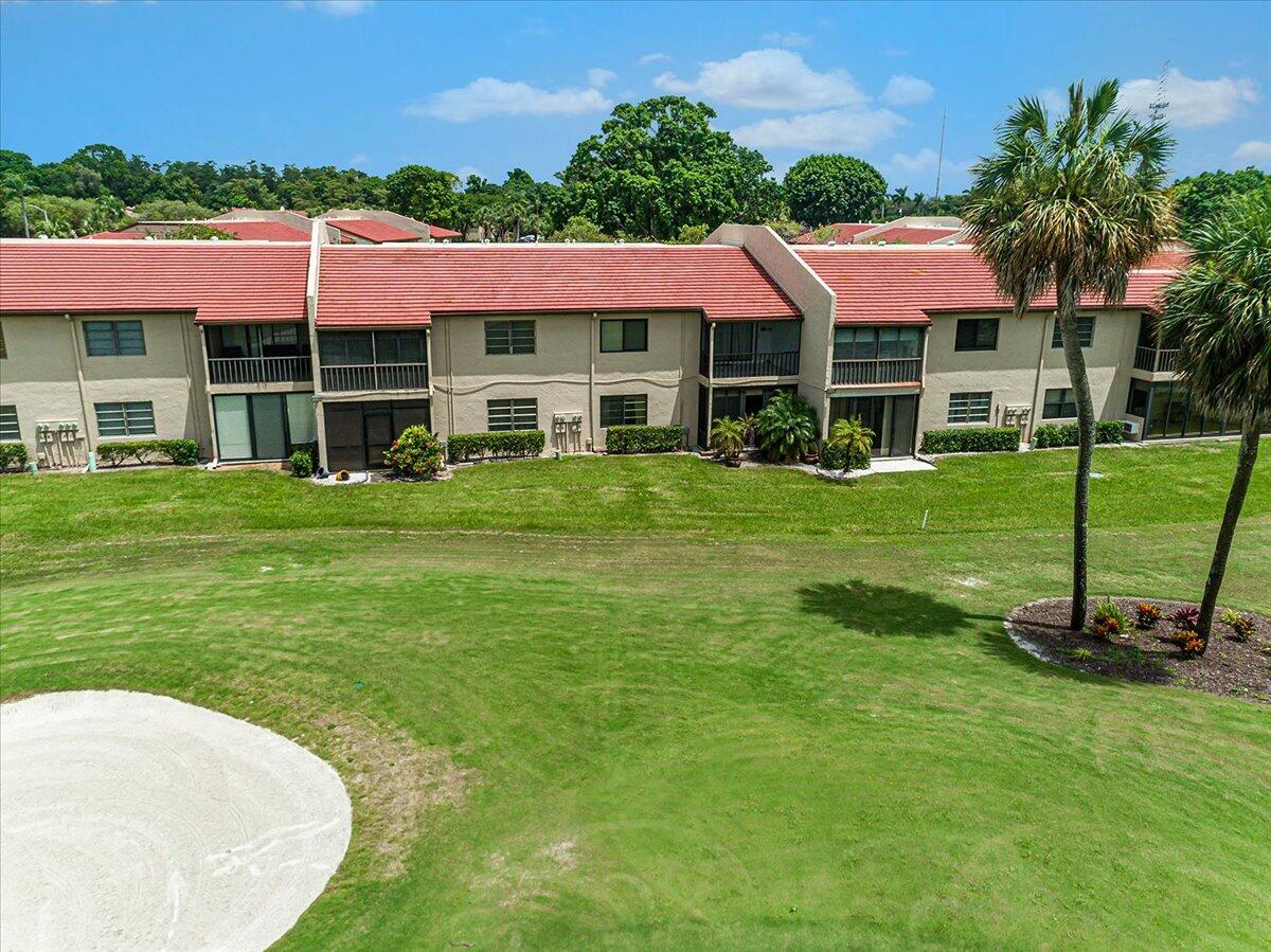 21719 Arriba Real, Unit J Boca Raton, FL 33433 - Photo 29 of 33 a view of a house with a backyard