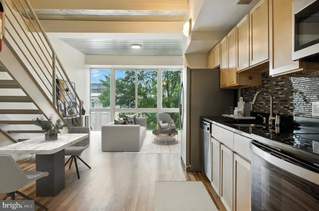 a kitchen with a table chairs and a stove