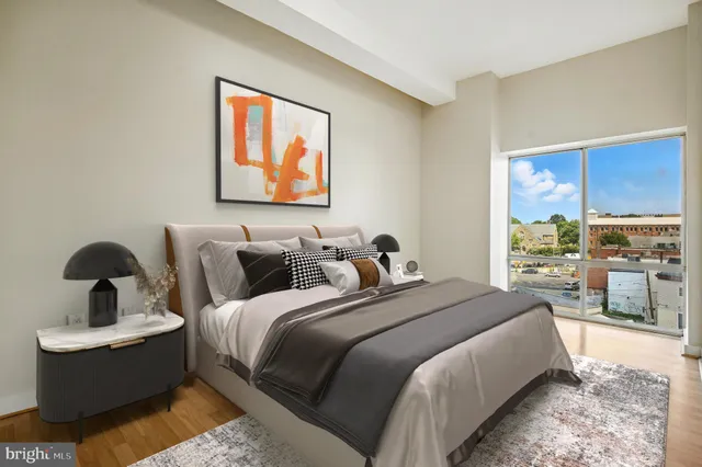 a bedroom with bed and window