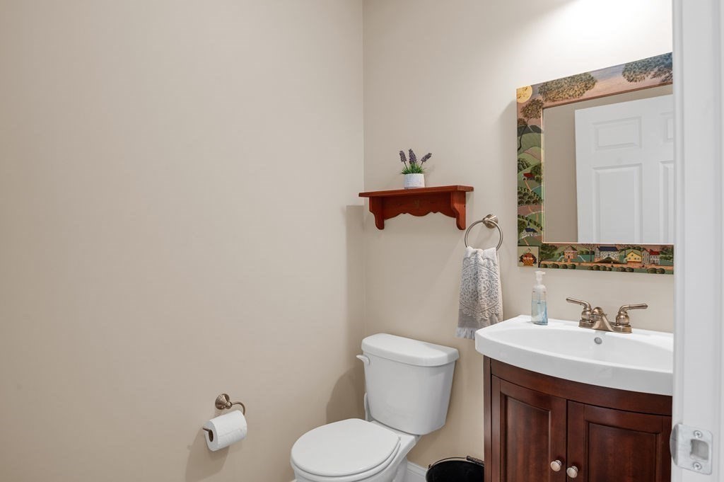 13 Freedom Way, Unit 13 Merrimac, MA 01860 - Photo 13 of 26 a bathroom with a sink toilet and mirror