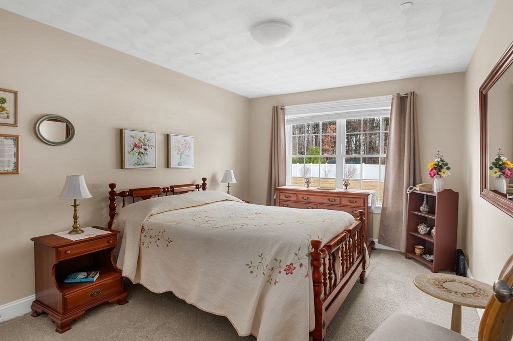 13 Freedom Way, Unit 13 Merrimac, MA 01860 - Photo 14 of 26 a bedroom with a bed and a window