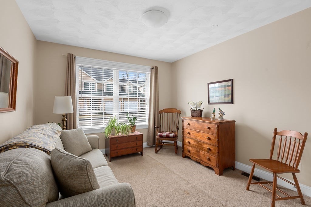 13 Freedom Way, Unit 13 Merrimac, MA 01860 - Photo 17 of 26 a bedroom with furniture and a window