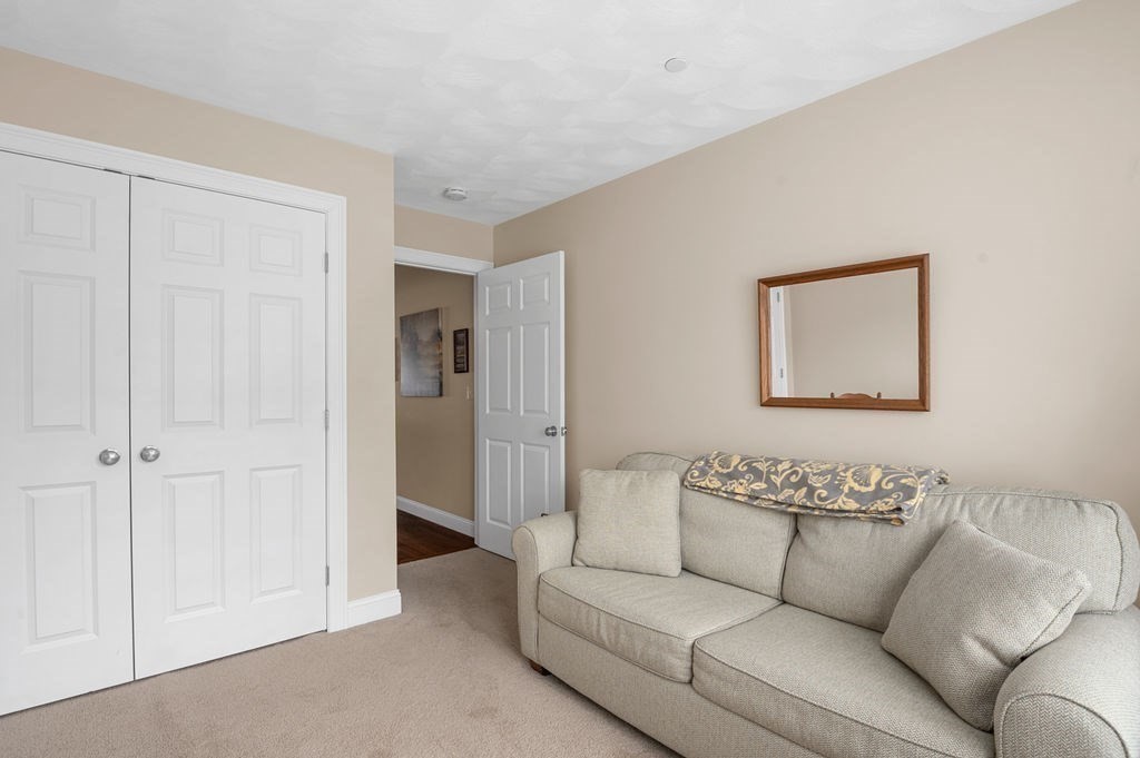 13 Freedom Way, Unit 13 Merrimac, MA 01860 - Photo 18 of 26 a living room with furniture and a walk in closet