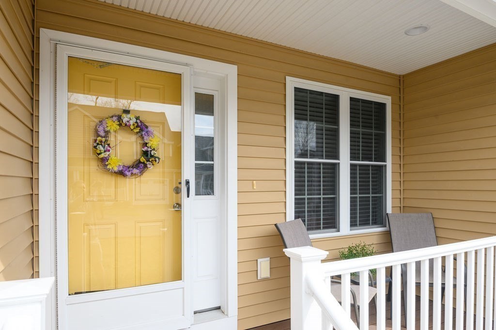 13 Freedom Way, Unit 13 Merrimac, MA 01860 - Photo 2 of 26 a view of a porch with a table and chairs