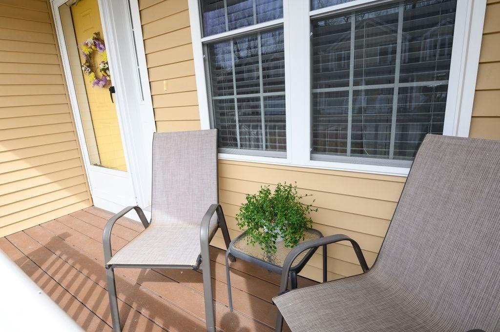 13 Freedom Way, Unit 13 Merrimac, MA 01860 - Photo 3 of 26 a balcony with table and chairs