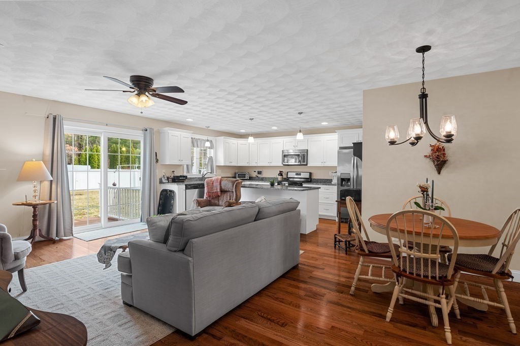 13 Freedom Way, Unit 13 Merrimac, MA 01860 - Photo 5 of 26 a living room with furniture and kitchen view