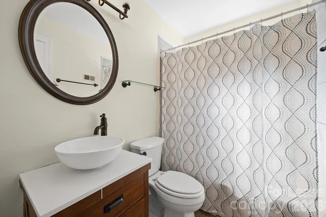 a bathroom with a toilet and a sink