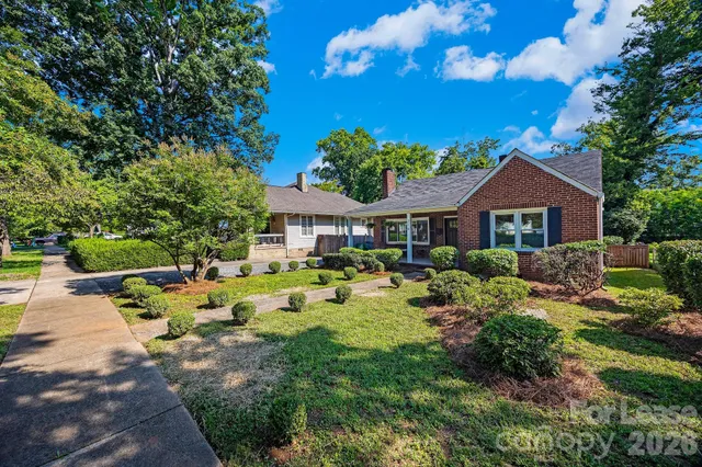 a front view of house with yard outdoor seating and green space