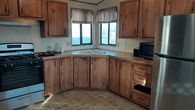 a kitchen with a refrigerator and a sink