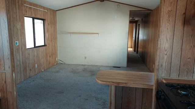 a bathroom with a granite countertop sink and shower