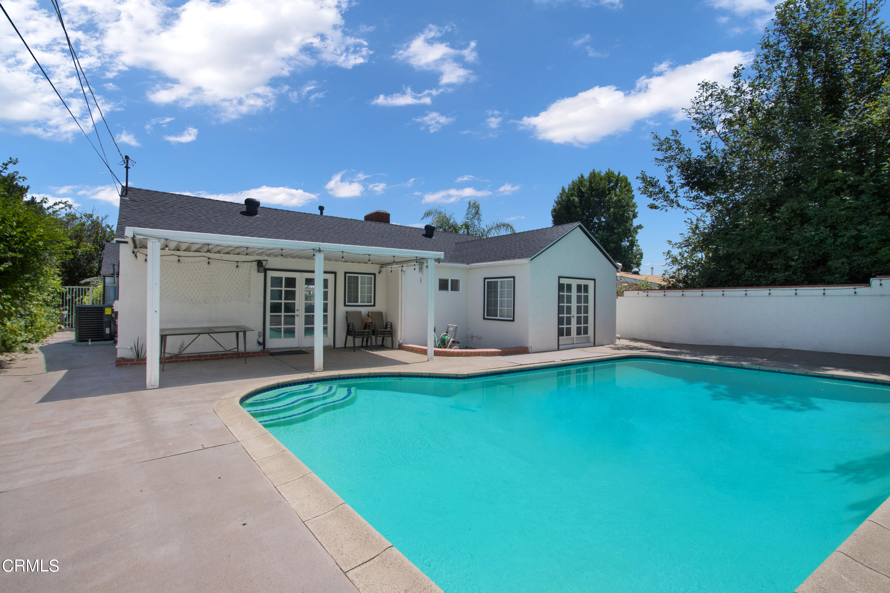 1029 Cynthia Avenue Pasadena, CA 91107 - Photo 18 of 19 a view of a house with swimming pool and a yard