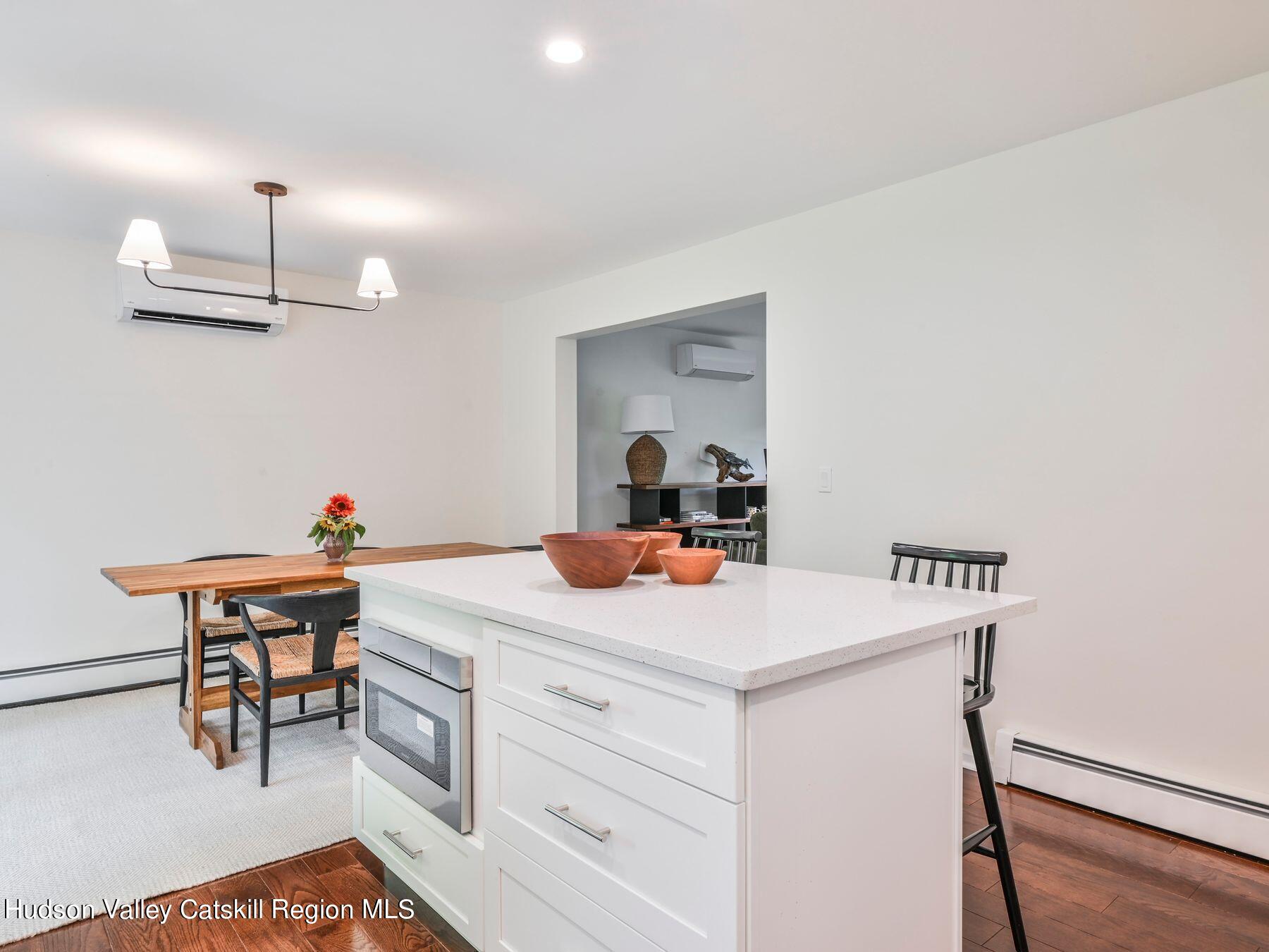 14 Red Maple Road Shokan, NY 12481 - Photo 16 of 34 a room with a table chairs and a wooden floor