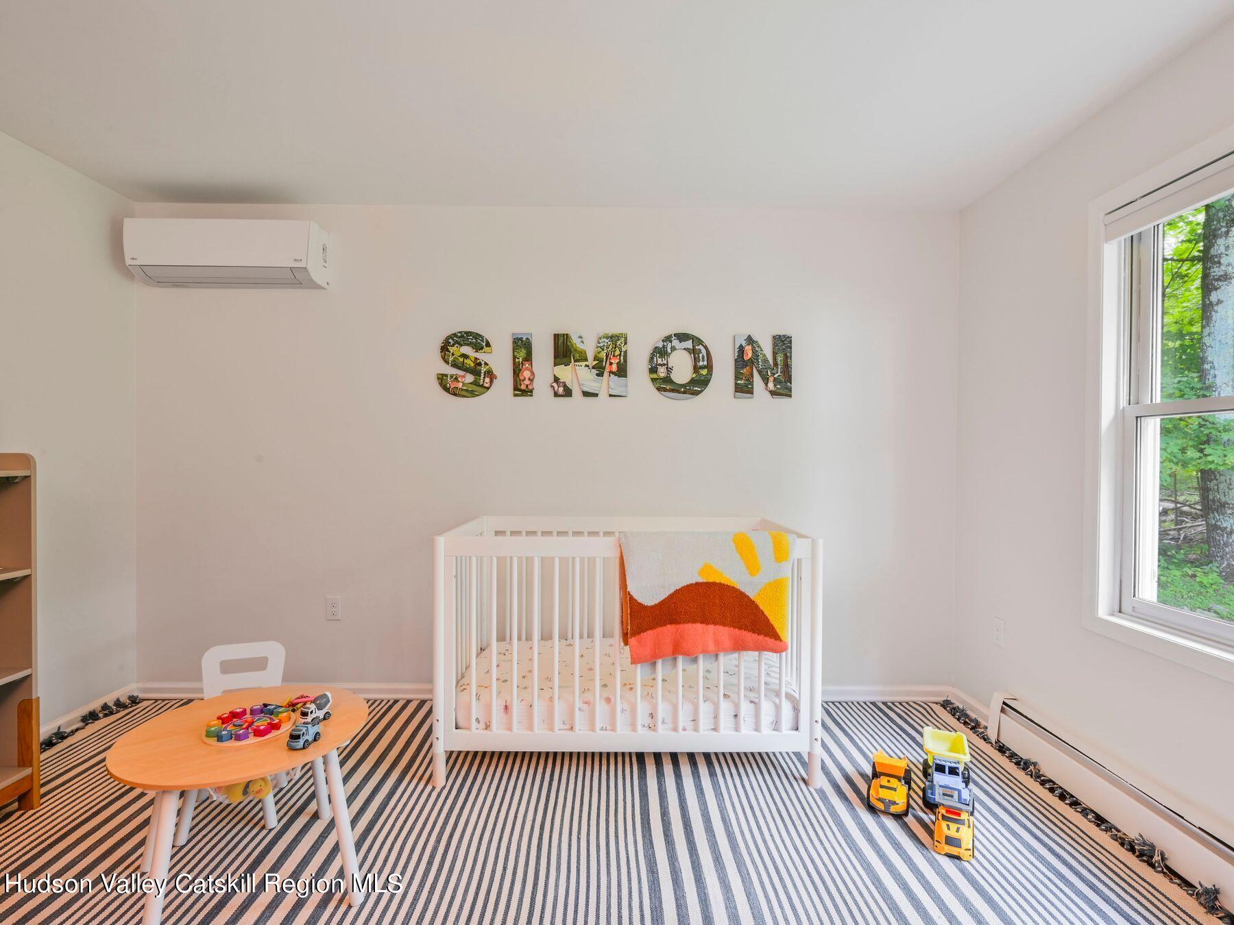 14 Red Maple Road Shokan, NY 12481 - Photo 20 of 34 a bedroom with a bed and a book shelf