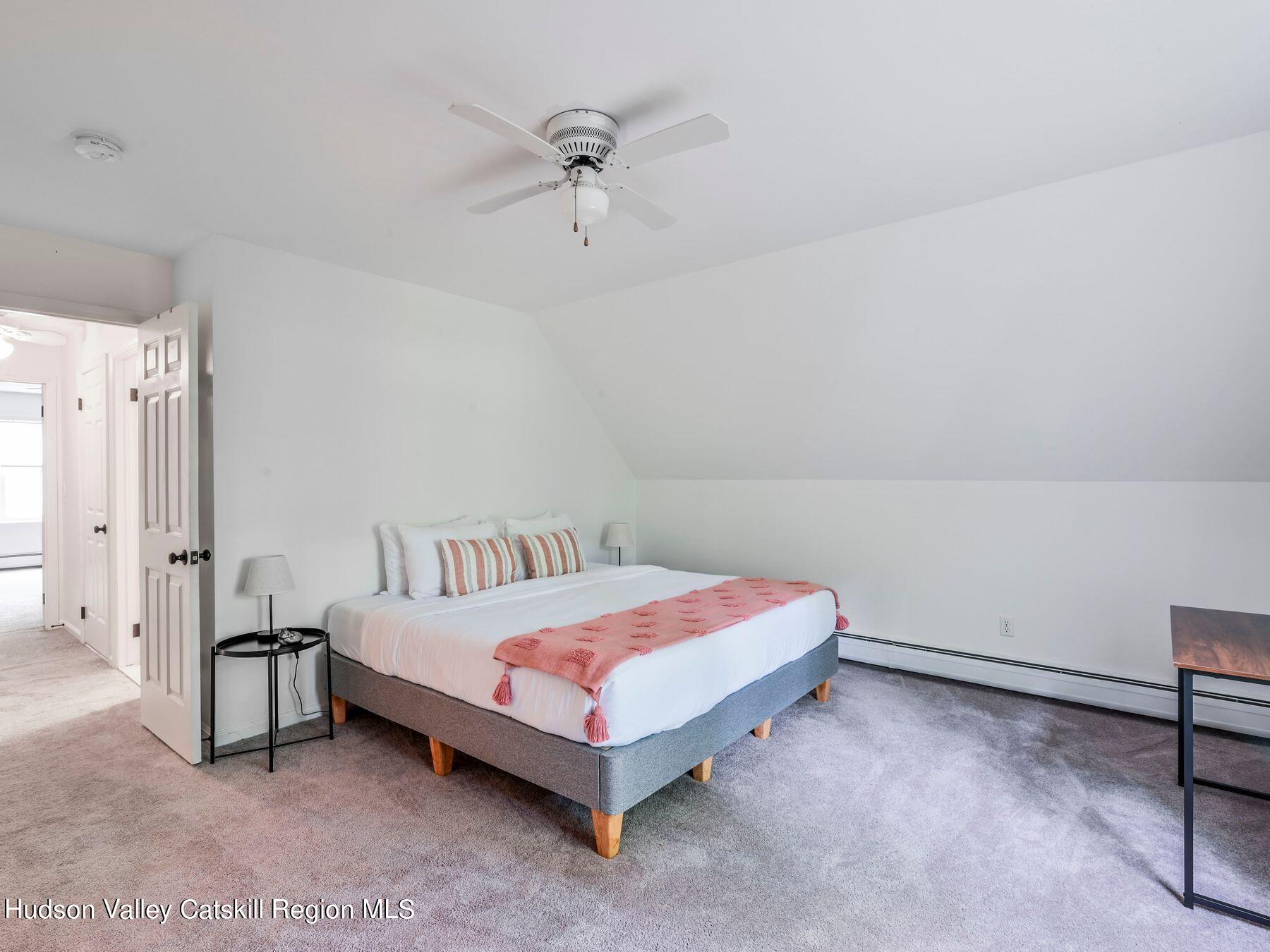 14 Red Maple Road Shokan, NY 12481 - Photo 23 of 34 a bedroom with a bed and a table