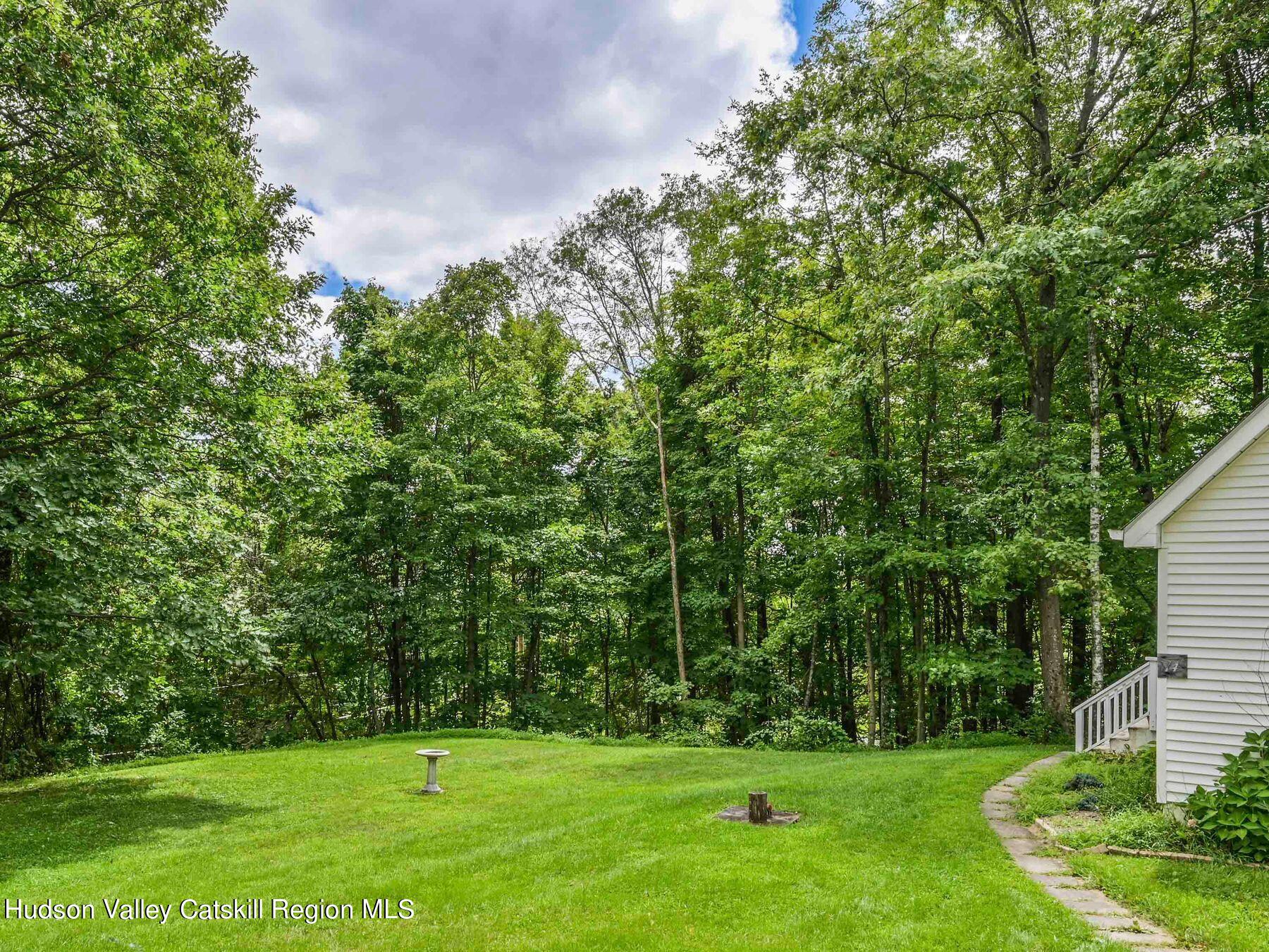 14 Red Maple Road Shokan, NY 12481 - Photo 3 of 34 a view of a green field with wooden fence
