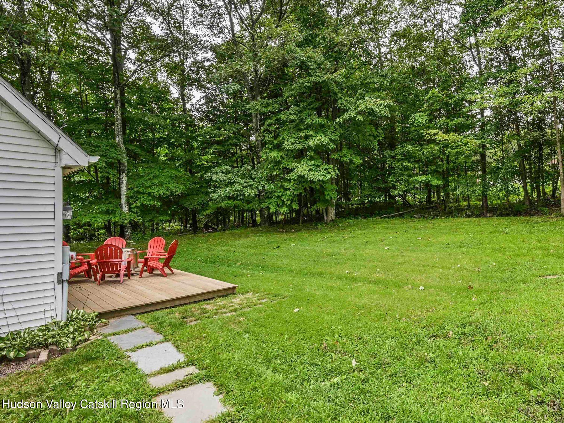 14 Red Maple Road Shokan, NY 12481 - Photo 4 of 34 a view of a table and chairs in the garden