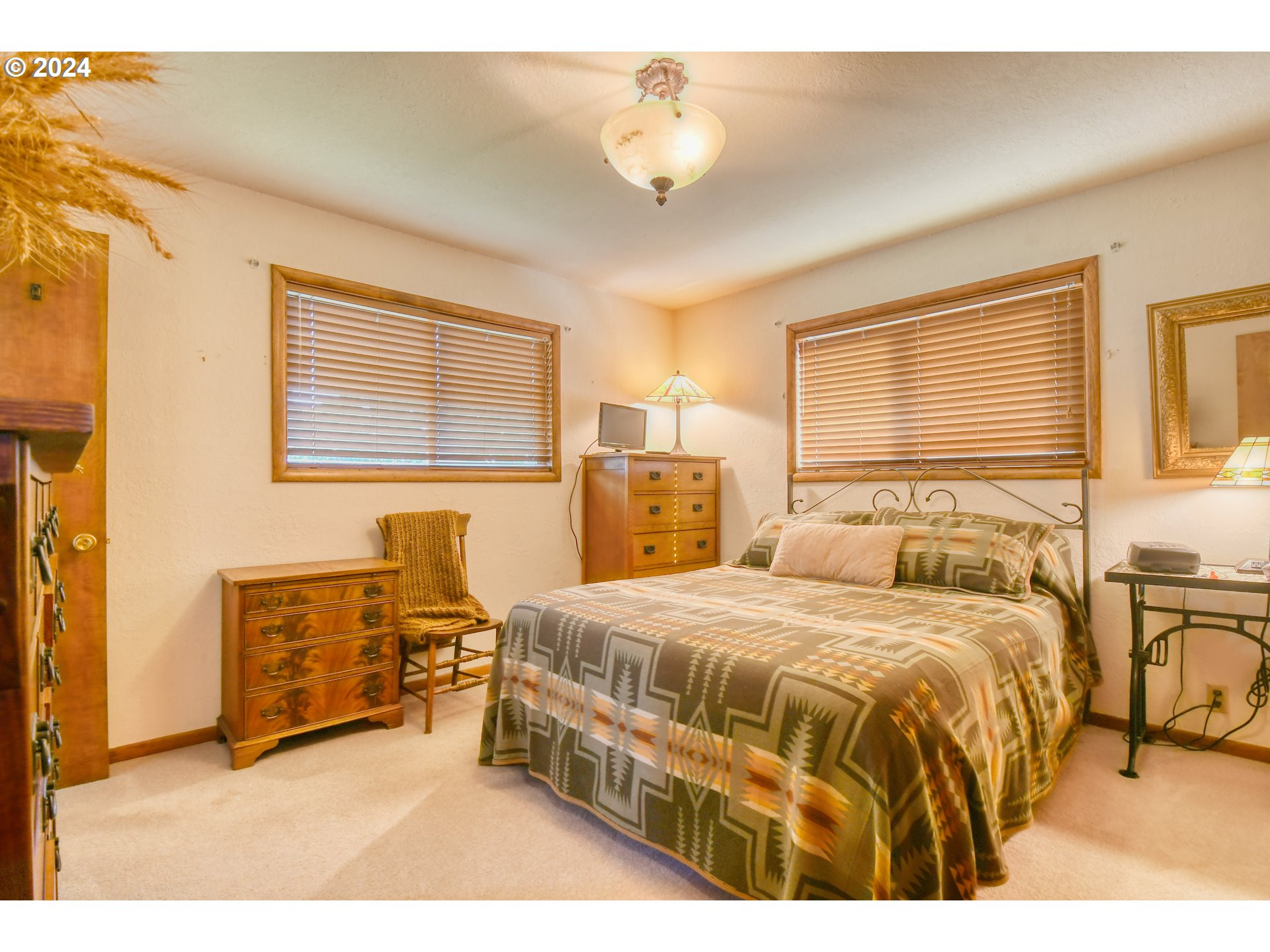 75468 McCormmach Road Pendleton, OR 97801 - Photo 15 of 48 a bedroom with a bed a table and chair