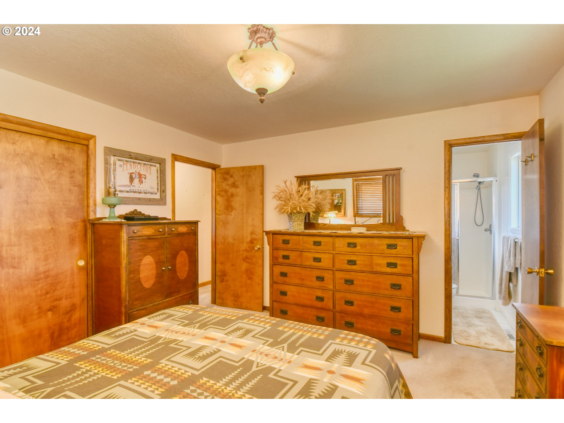 75468 McCormmach Road Pendleton, OR 97801 - Photo 16 of 48 a bedroom with a bed and cabinets