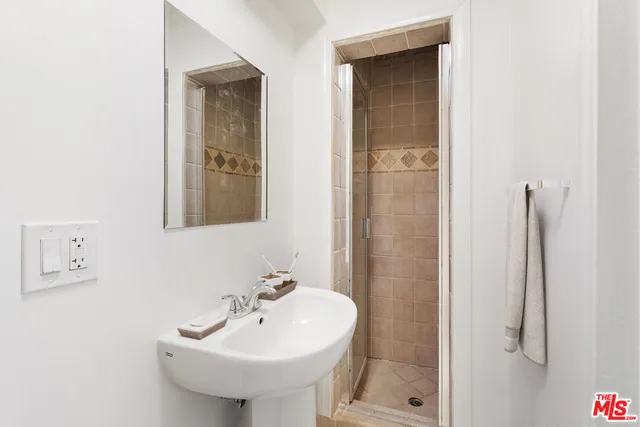 a bathroom with a sink and a mirror