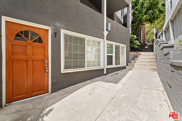 a front view of a house with a large window