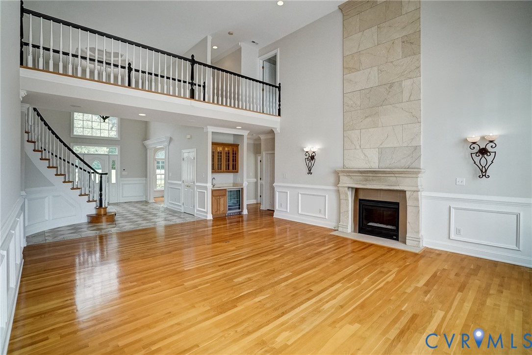 721 Meadow View Ridge Manakin-Sabot, VA 23103 - Photo 7 of 45 a view of an empty room with wooden floor and a fireplace