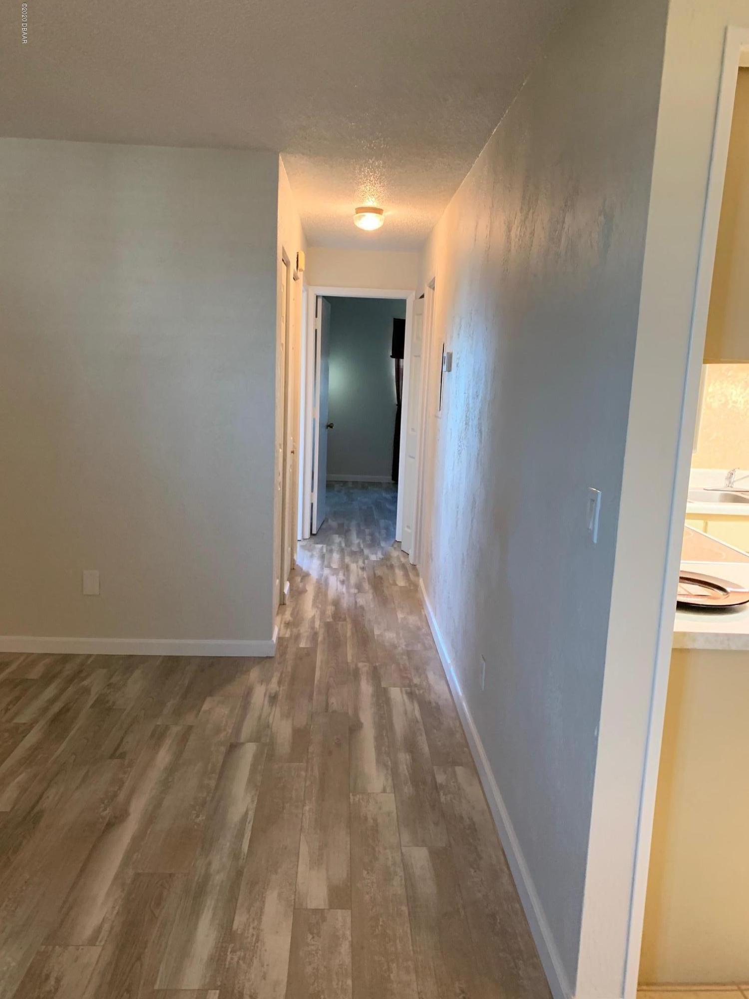 2250 Ocean Shore Boulevard, Unit 2030 Ormond Beach, FL 32176 - Photo 4 of 7 a view of hallway with natural light