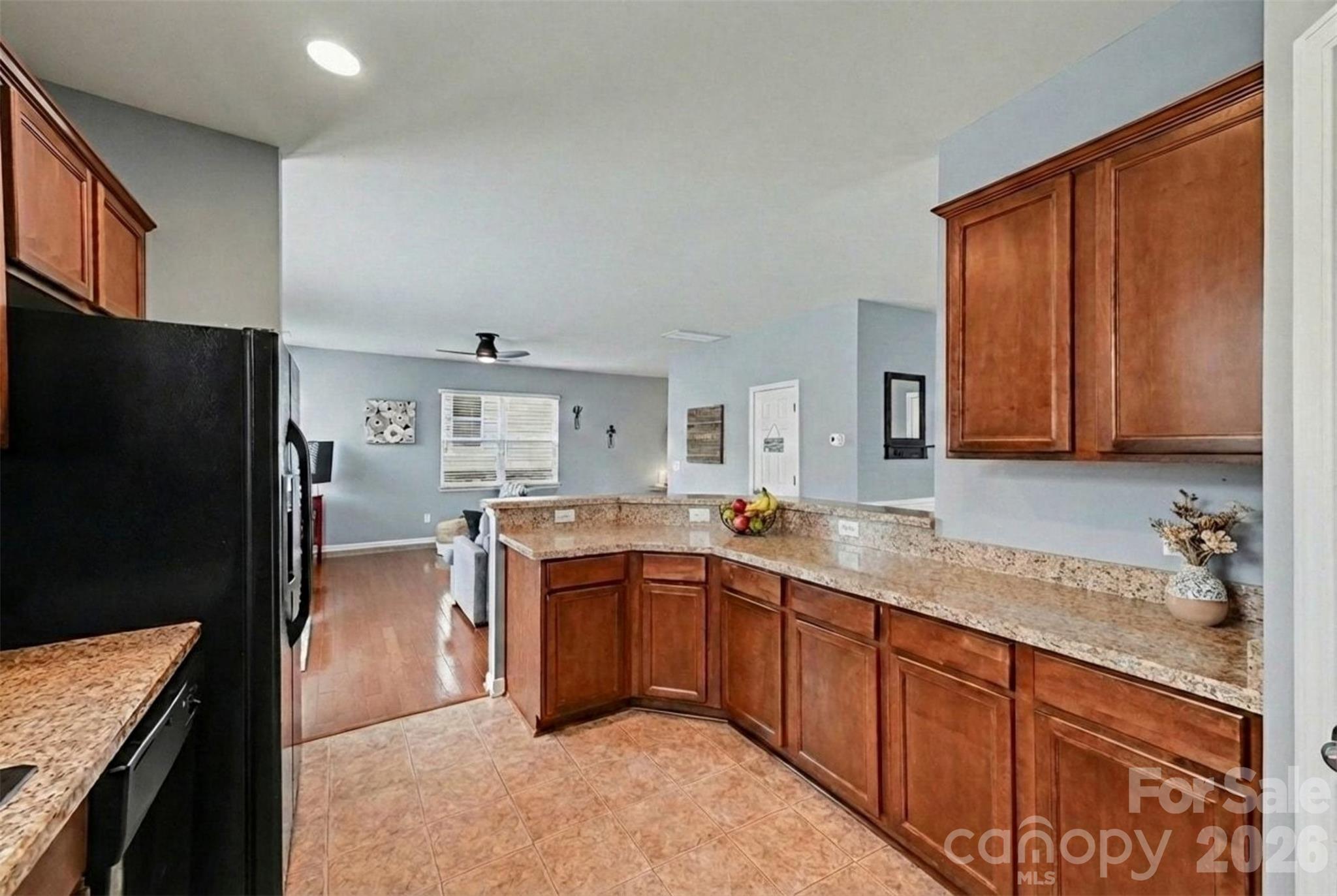 3009 Canopy Drive Indian Trail, NC 28079 - Photo 14 of 35 a kitchen with stainless steel appliances granite countertop a sink stove and refrigerator