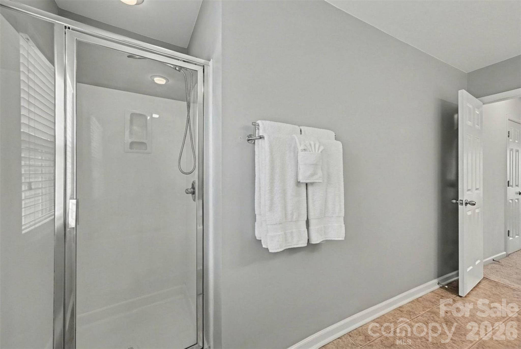 3009 Canopy Drive Indian Trail, NC 28079 - Photo 21 of 35 a bathroom with a shower and mirror