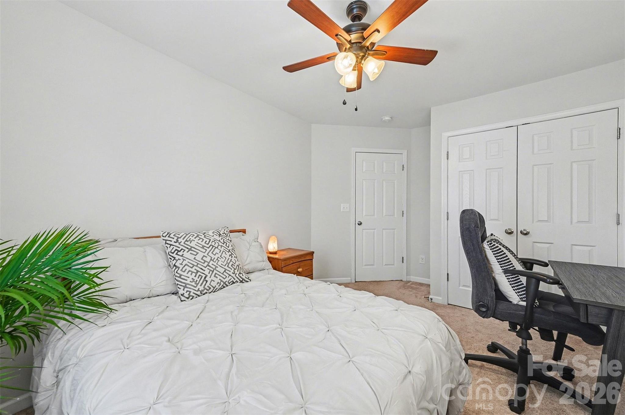 3009 Canopy Drive Indian Trail, NC 28079 - Photo 23 of 35 a bedroom with a bed and a chandelier