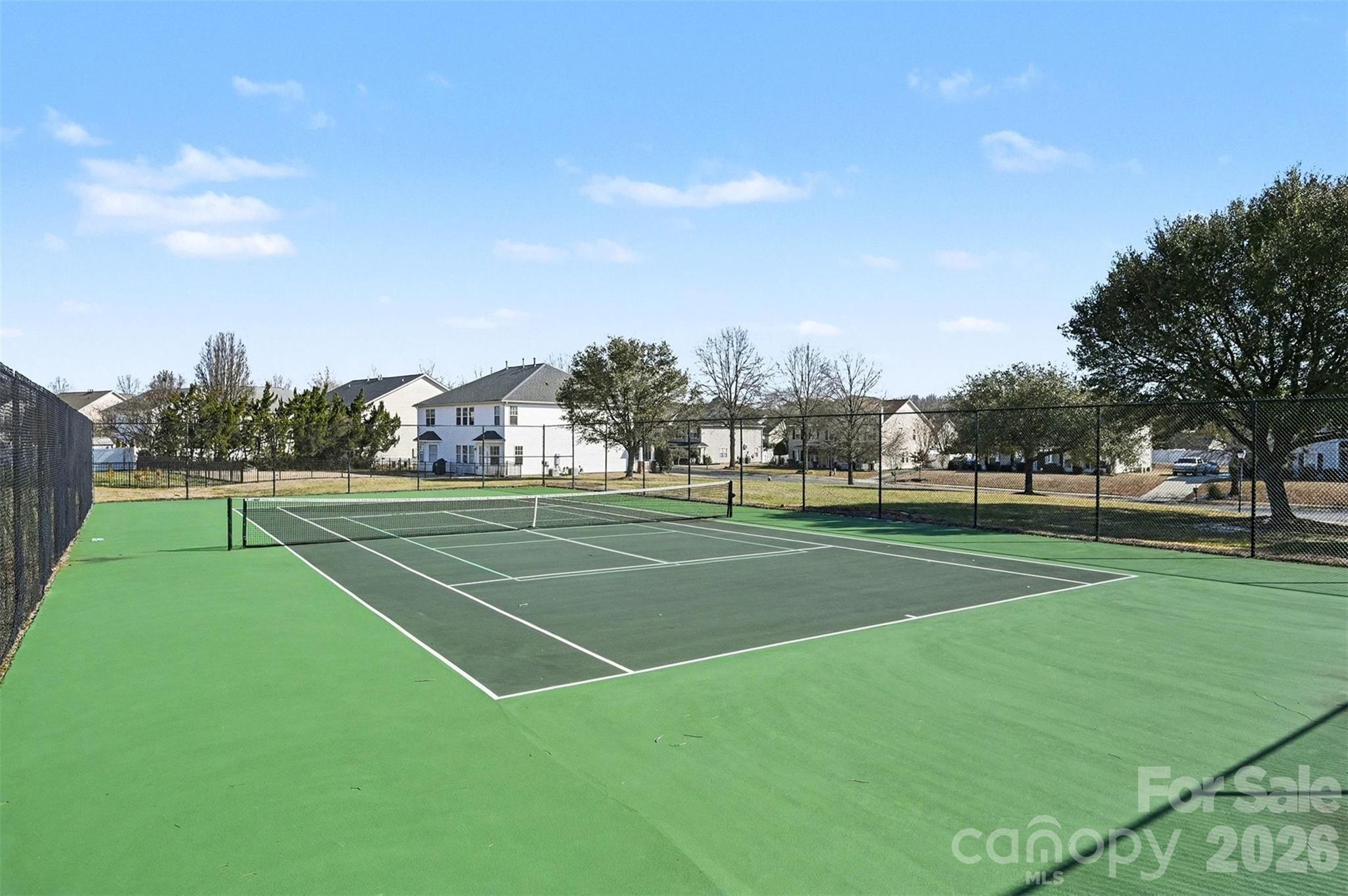 3009 Canopy Drive Indian Trail, NC 28079 - Photo 30 of 35 a view of a tennis ground with large trees
