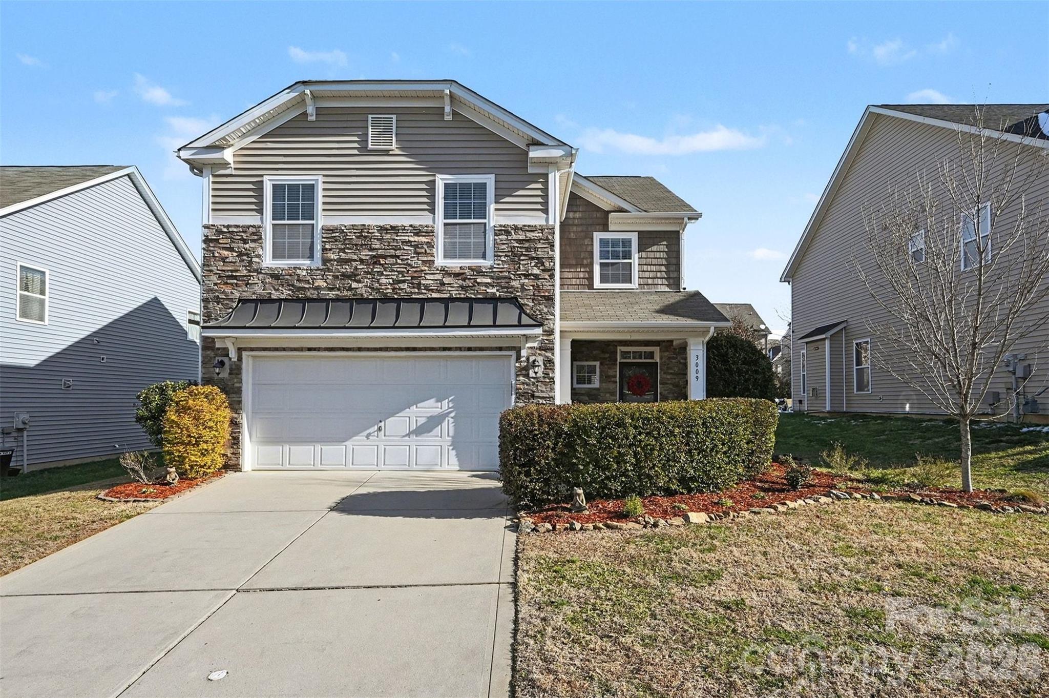 3009 Canopy Drive Indian Trail, NC 28079 - Photo 4 of 35 a front view of a house with a yard