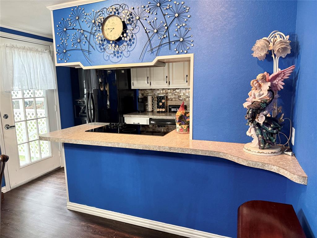 4216 Greenwood Road Weatherford, TX 76088 - Photo 17 of 26 Dining has pass through bar to kitchen. Door to left opens to terrace patio.