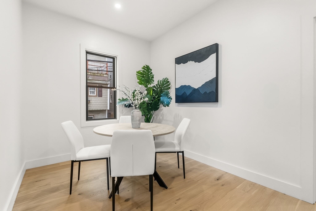 47 Condor Street, Unit 203A Boston, MA 02128 - Photo 5 of 15 a view of a dining room with furniture and window