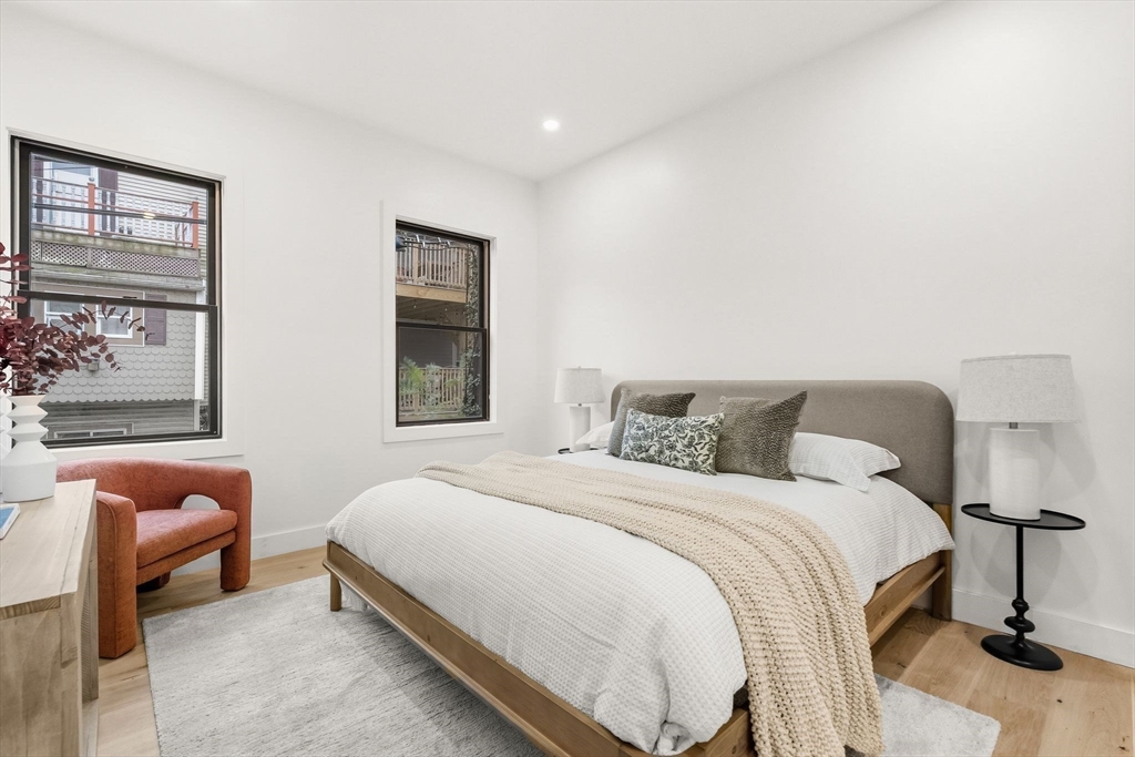 47 Condor Street, Unit 203A Boston, MA 02128 - Photo 6 of 15 a bedroom with a bed and window