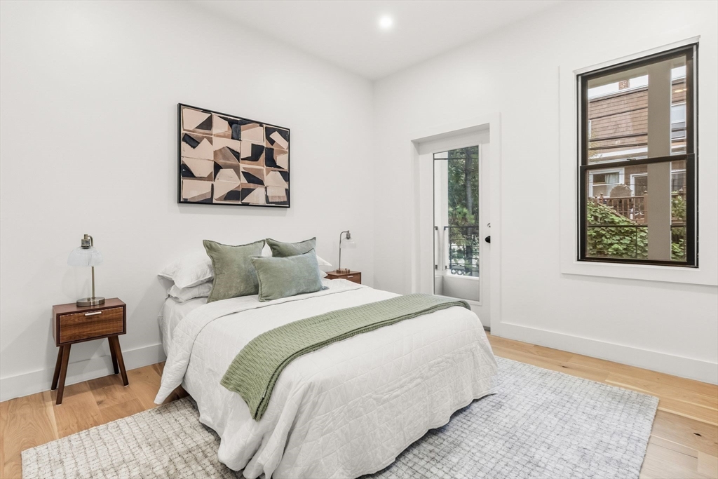 47 Condor Street, Unit 203A Boston, MA 02128 - Photo 9 of 15 a bedroom with bed and a window