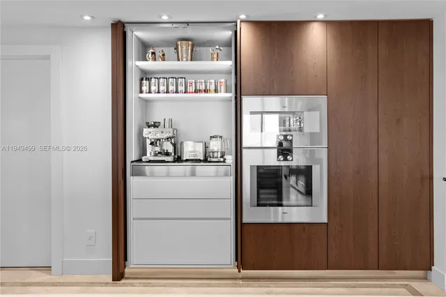 a bathroom with a sink mirror and toilet
