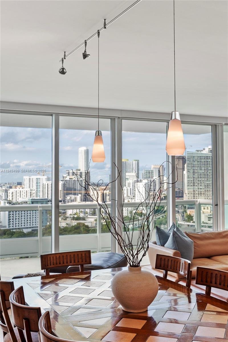1643 Brickell Avenue, Unit 2506 Miami, FL 33129 - Photo 14 of 85 a living room with furniture and a floor to ceiling window