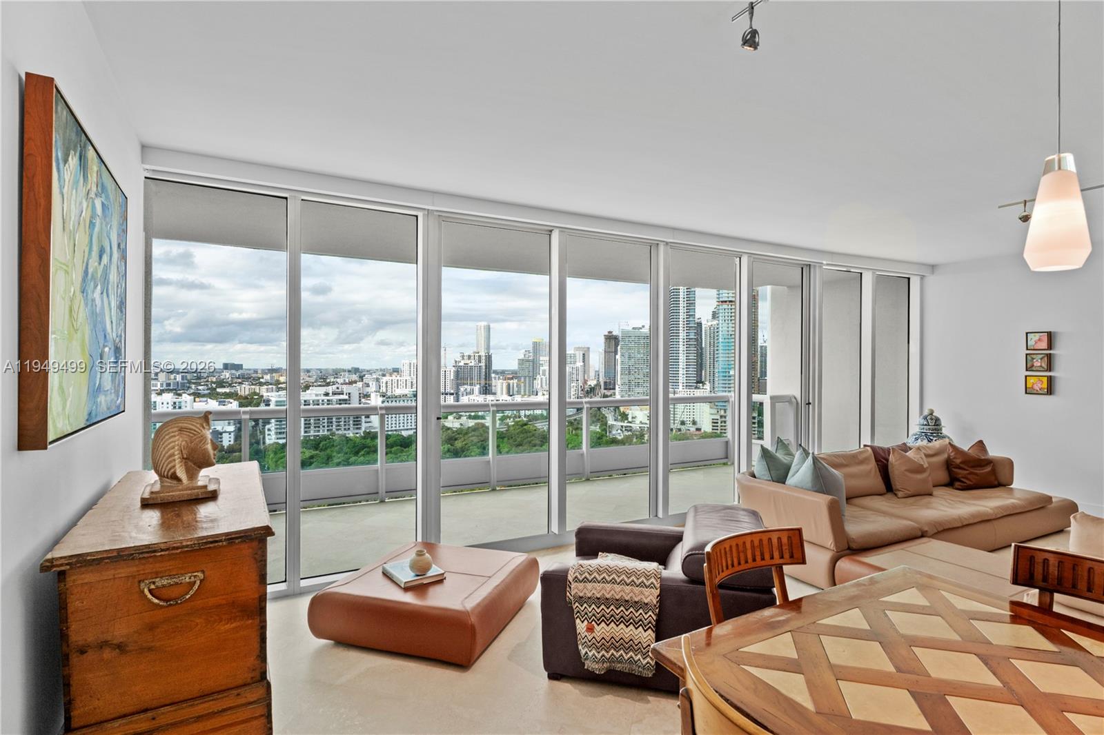 1643 Brickell Avenue, Unit 2506 Miami, FL 33129 - Photo 15 of 85 a living room with furniture and a floor to ceiling window