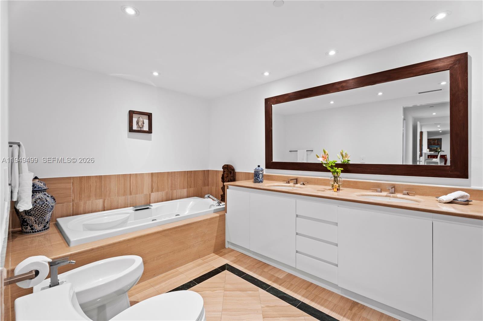 1643 Brickell Avenue, Unit 2506 Miami, FL 33129 - Photo 20 of 85 a bathroom with a sink mirror and toilet