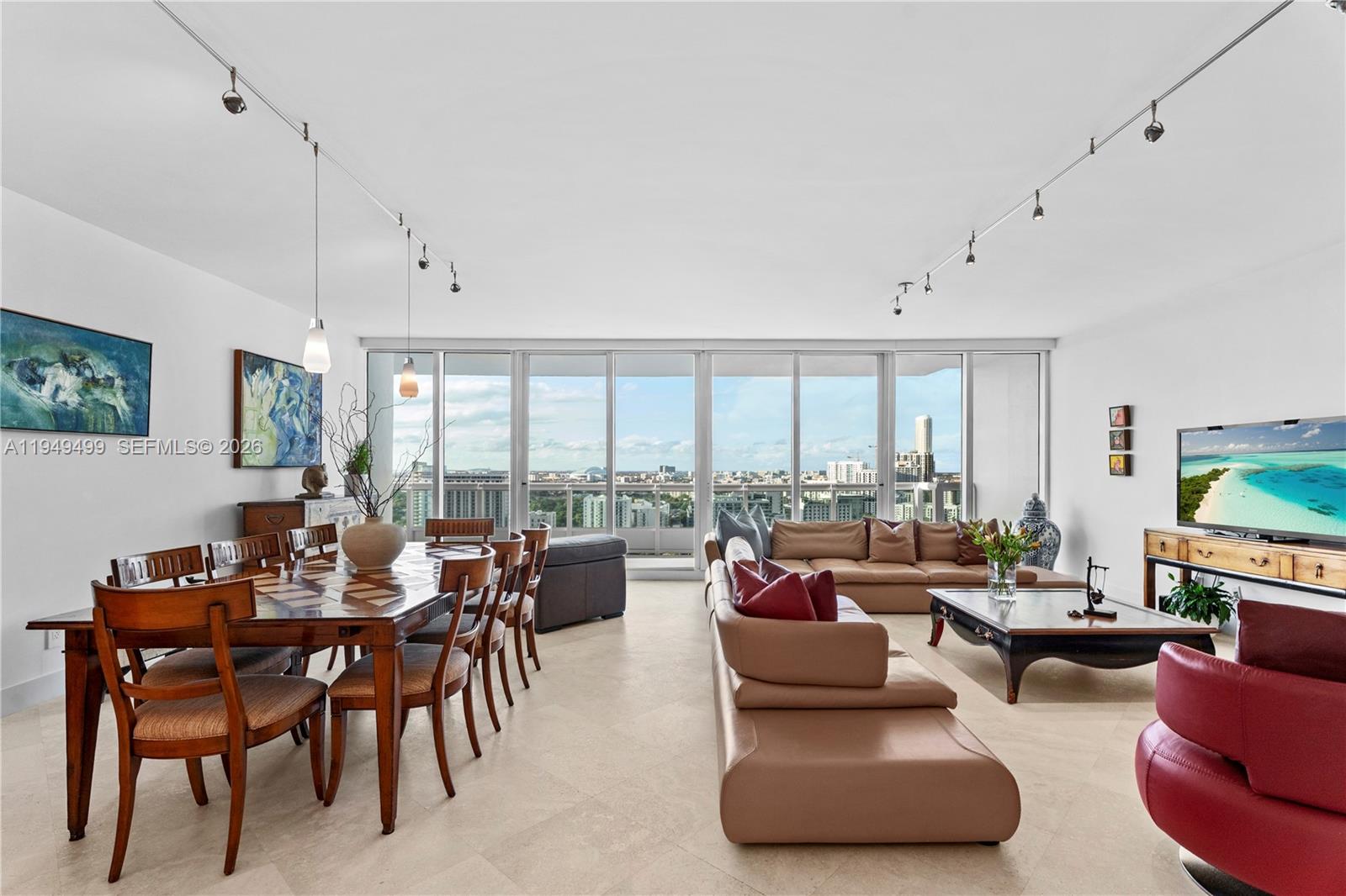 1643 Brickell Avenue, Unit 2506 Miami, FL 33129 - Photo 27 of 85 a living room with furniture and a large window