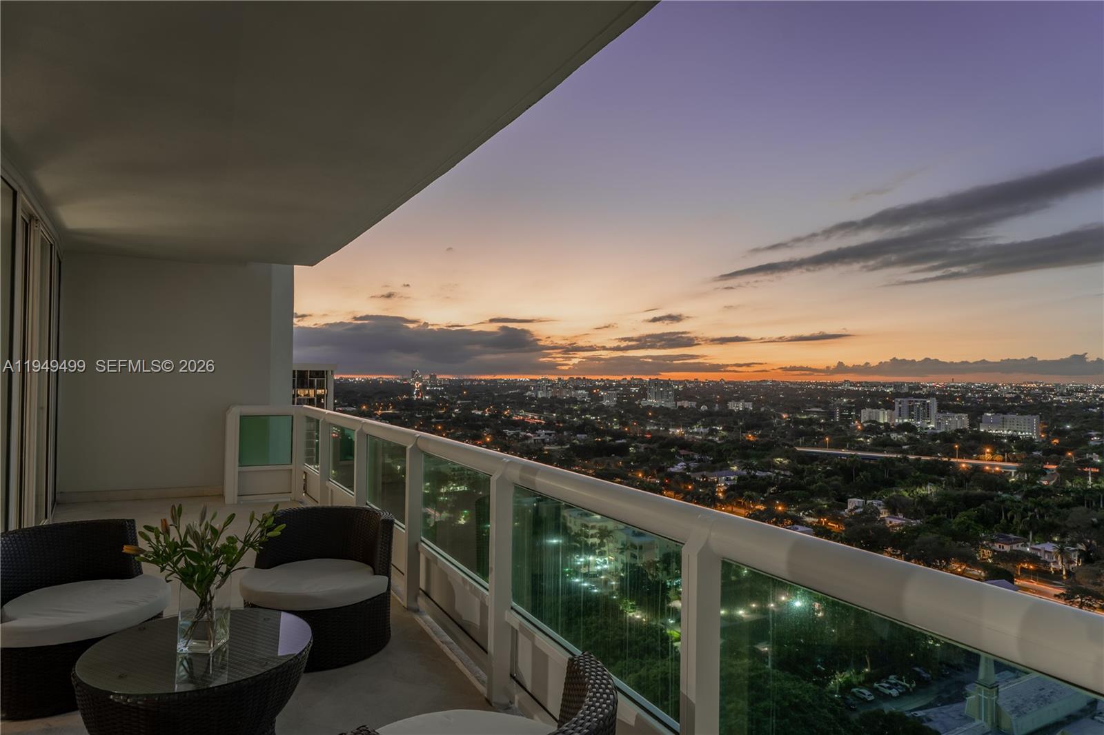 1643 Brickell Avenue, Unit 2506 Miami, FL 33129 - Photo 33 of 85 a view of a balcony with couches and wooden floor
