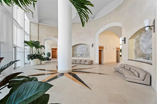 a view of a house with a backyard and a tree