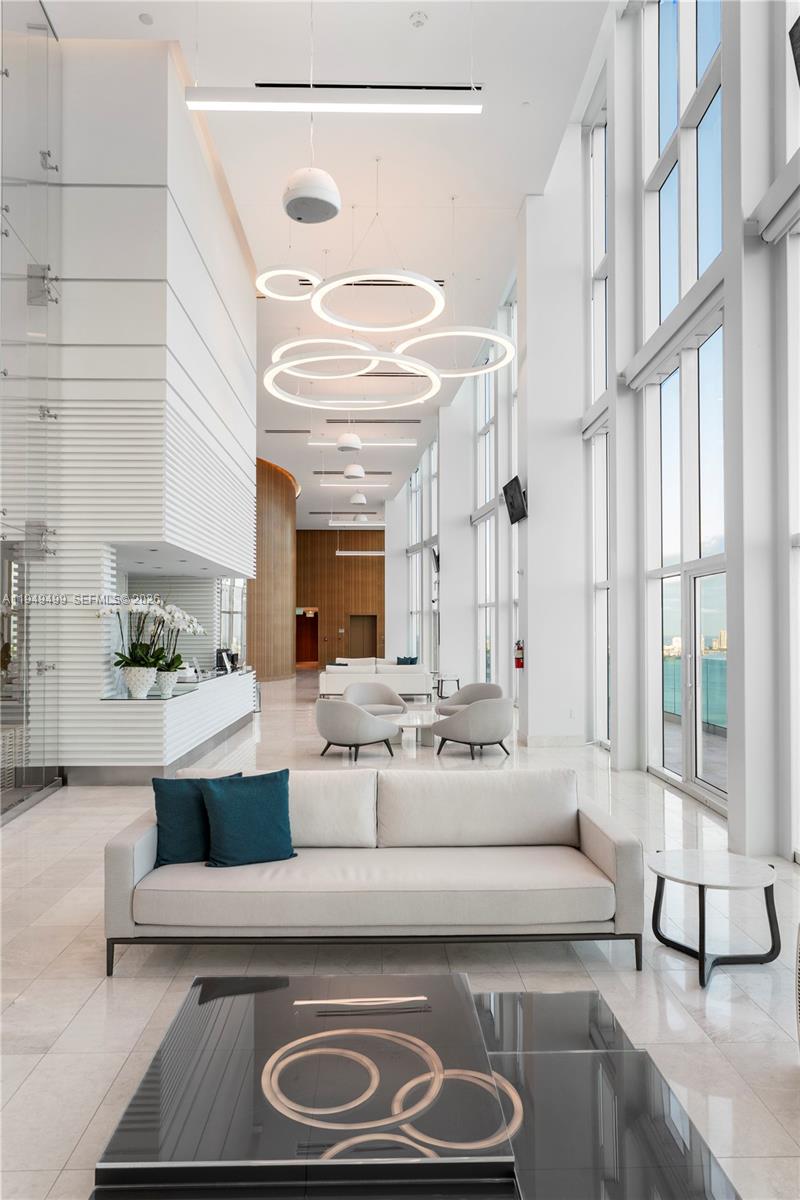 1643 Brickell Avenue, Unit 2506 Miami, FL 33129 - Photo 53 of 85 a living room with furniture and a large window