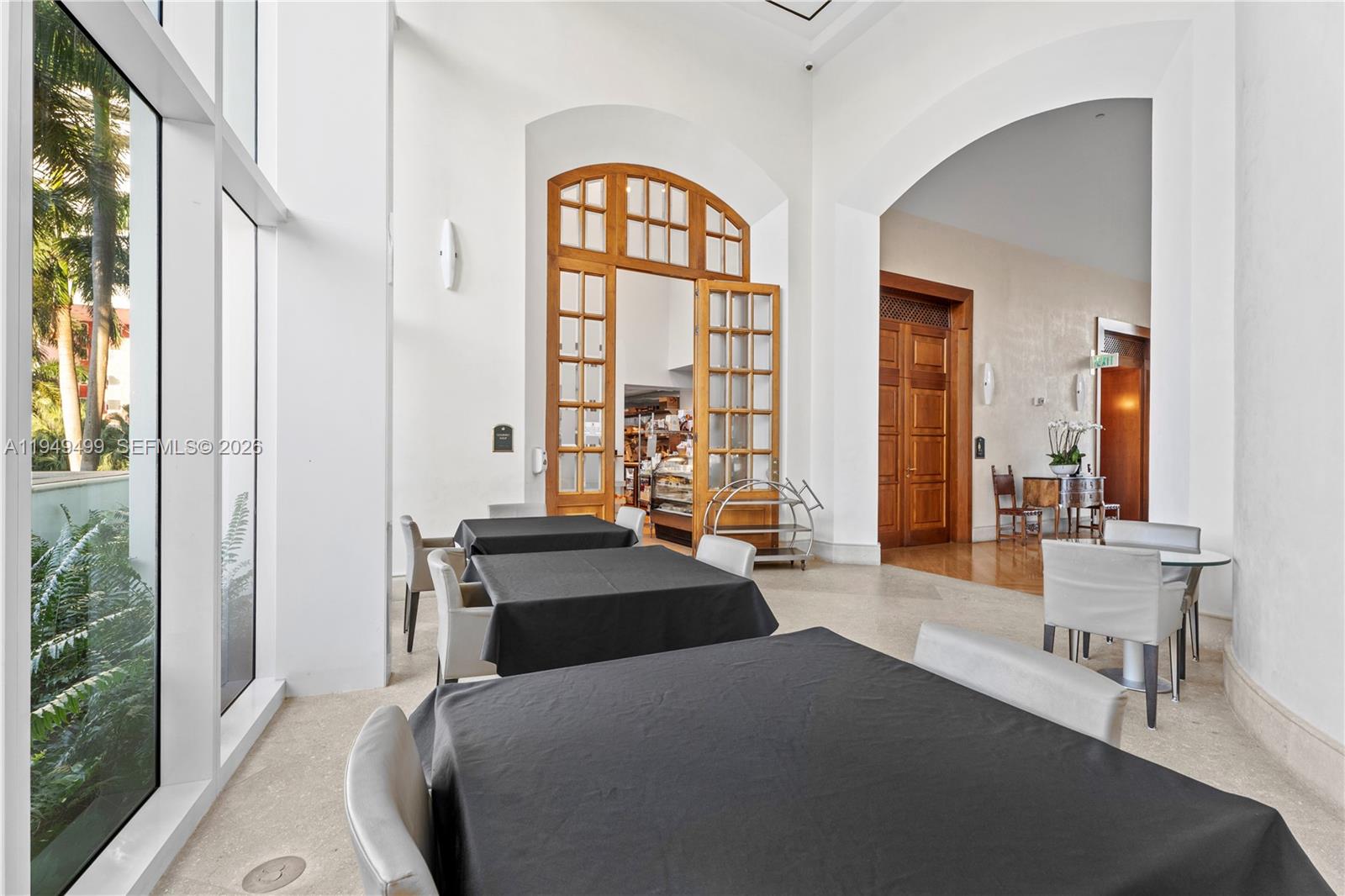 1643 Brickell Avenue, Unit 2506 Miami, FL 33129 - Photo 64 of 85 a bedroom with a bed and a large window